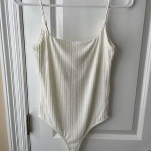 Miss Lola cream body suit. Never worn.